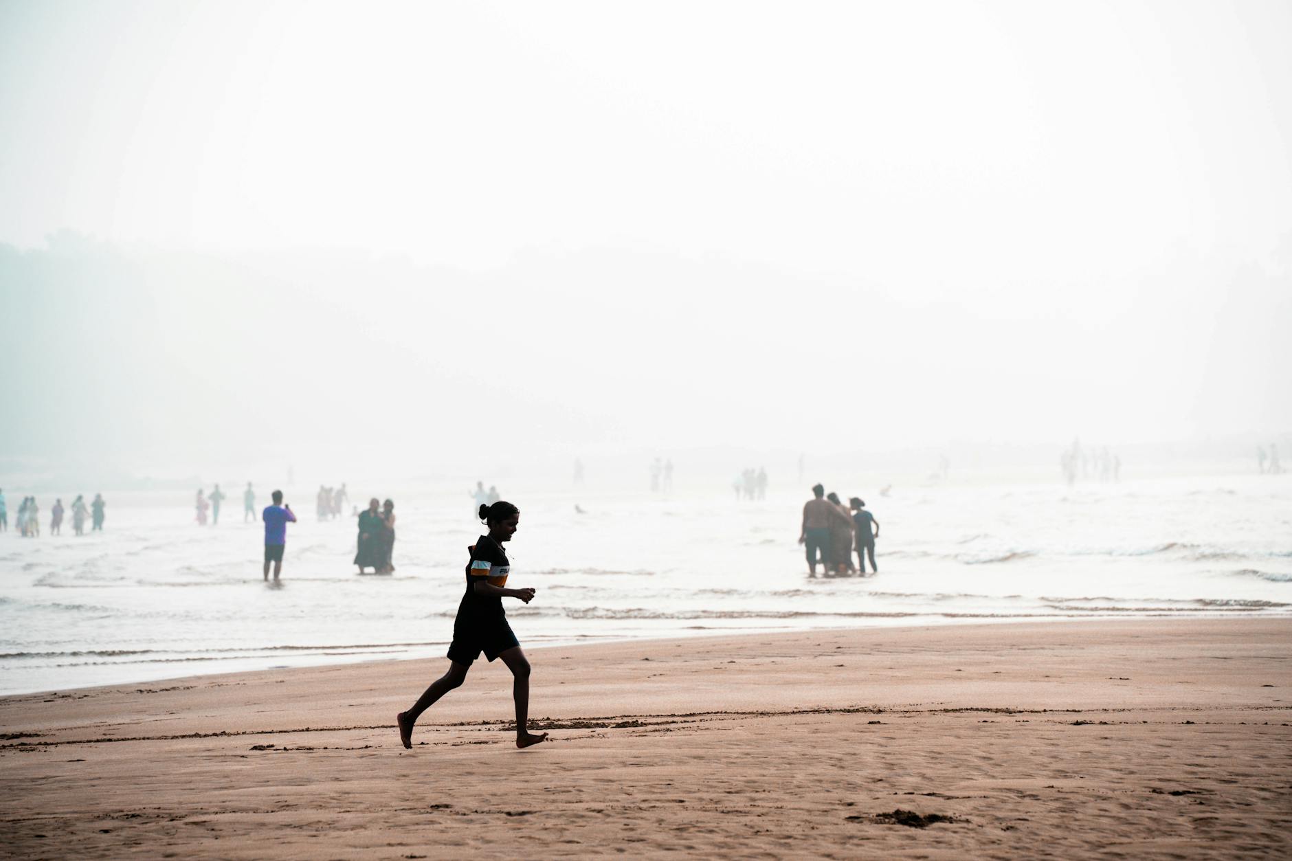 morning beach jog with misty atmosphere