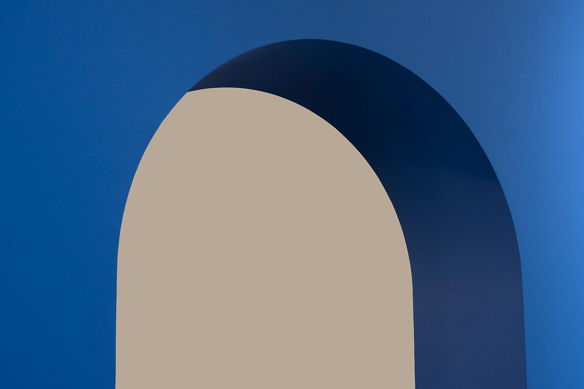 abstract blue archway against beige background